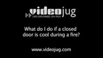 What do I do if a closed door is cool during a fire?: During A Fire