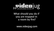 What should you do if you are trapped in a room by fire?: In The Event Of A Fire