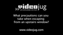 What precautions can you take when escaping from an upstairs window?: In The Event Of A Fire