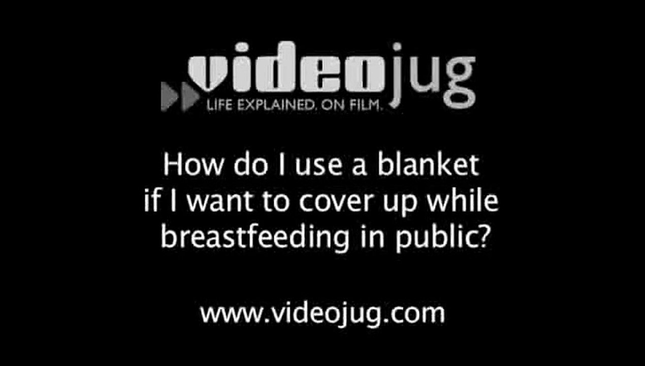 How do I use a blanket if I want to cover up while breastfeeding in