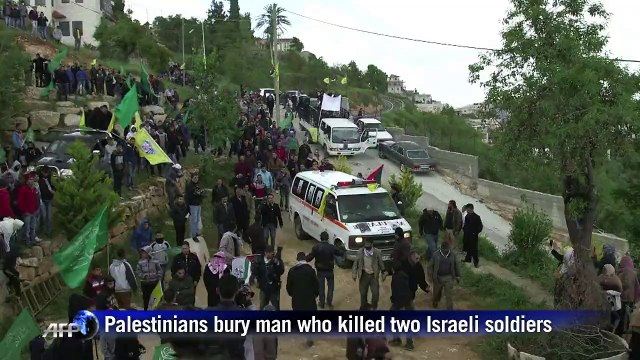 Palestinians bury man killed after stabbing 2 Israeli soldiers