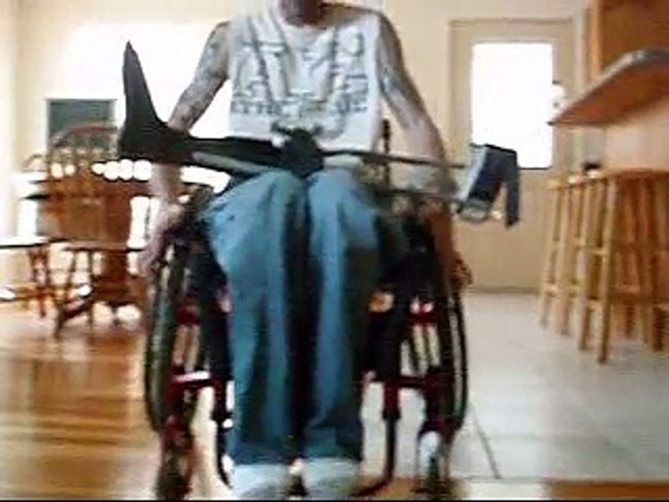 paraplegic walking in braces with walker