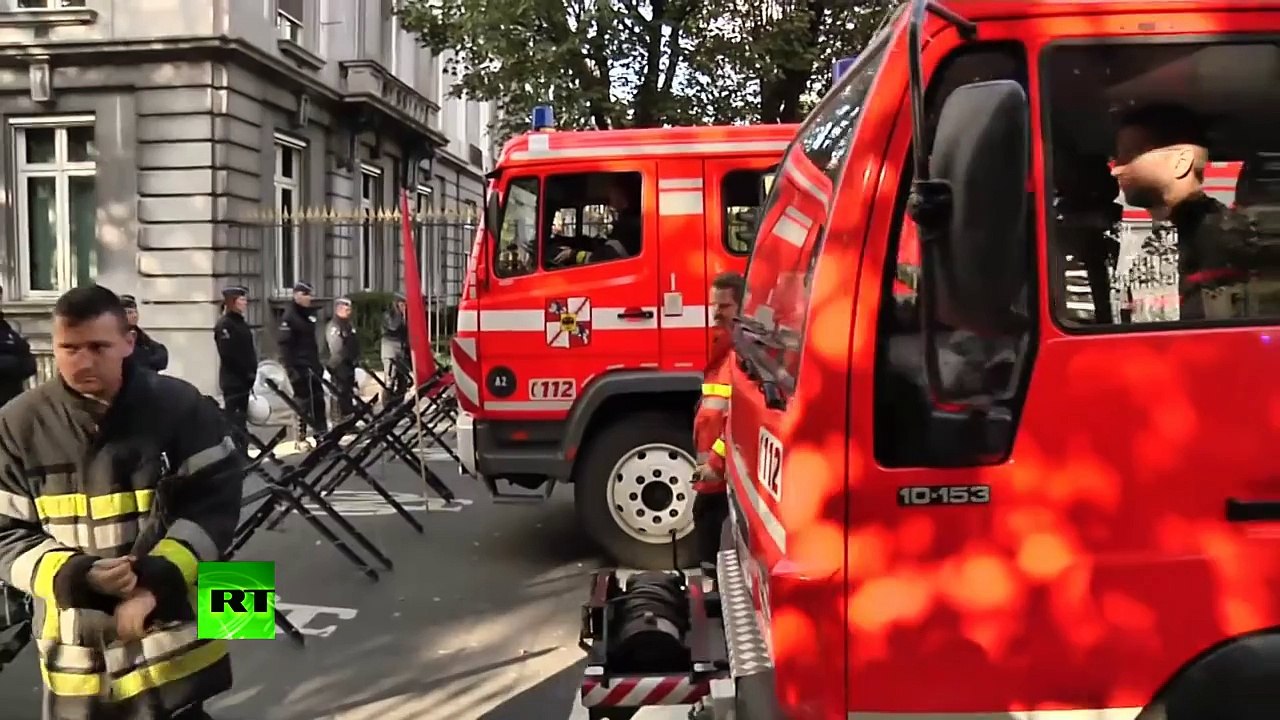 Video: Firemen soak cops in foam protesting cuts in Brussels