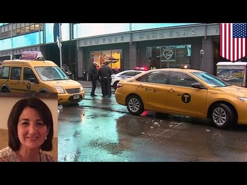 Woman gets hit by taxi, legs crushed between two cars in Times Square