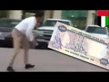 Make it rain: Money falling from the sky in Jumeirah, Dubai as UAE Dirham banknotes fly