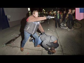 Demonstranci demaskują policjantów podczas pochodu