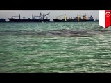 Oil spill off Singapore caused by collision of Alyarmouk oil tanker and Sinar Kapuas bulk carrier