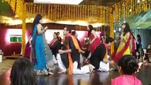 Girls & Boys dancing on the floor in mehndi
