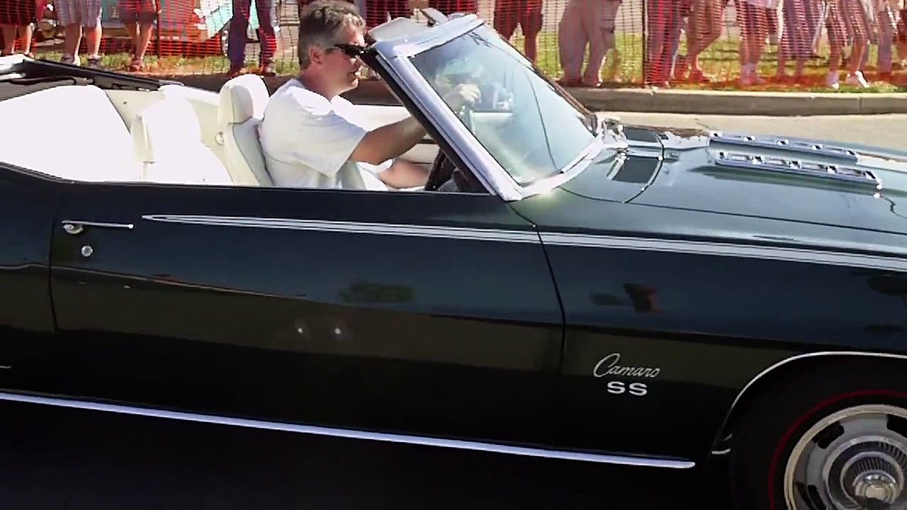Classic cars leaving car show (Riviera Boattail, too)