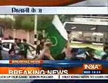 Kashmiris wave Pakistan flags