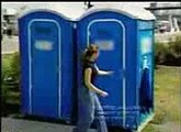 Girl takes a shower in a porta poddy