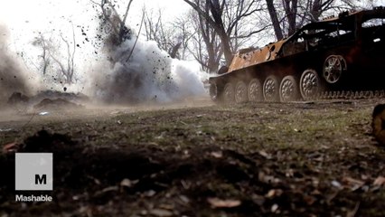 Pro-Russian separatist sappers blowing up discarded ordnance