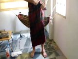 How a Man Wears Traditional Thai Sarong (Dress) in Thailand