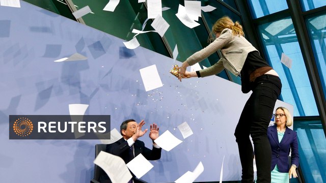 Protester aims for Draghi at ECB event