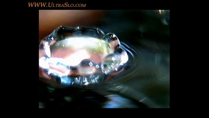 Macro slow motion water drop looking into the splash in UltraSlo