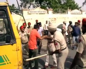 Police Lathicharge on School bus drivers