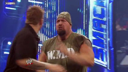 Friday Night SmackDown - Big Show chokeslams Mark Henry through the announce table