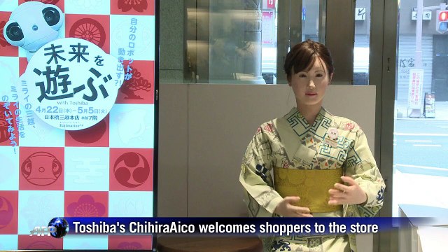 Japan humanoid robot receives customers at department store