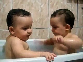 Twins Brothers Enjoying Bath Time