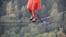 very brave girl walking on rope with high heel