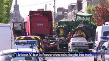 French passenger train slams into truck, 30 injured