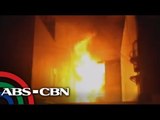 Fire spreads to building, homes in Manila