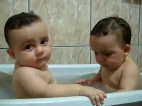 Twins Brothers Enjoying Bath Time