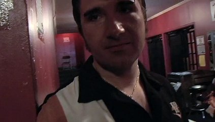 Will Debley on the wall outside Elvis Presley's house Graceland 2008