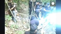 Malaysia: Police officials arrested as over 100 'migrant graves' discovered