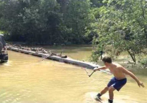 Wake Boarder Navigates Flooded Austin Creek