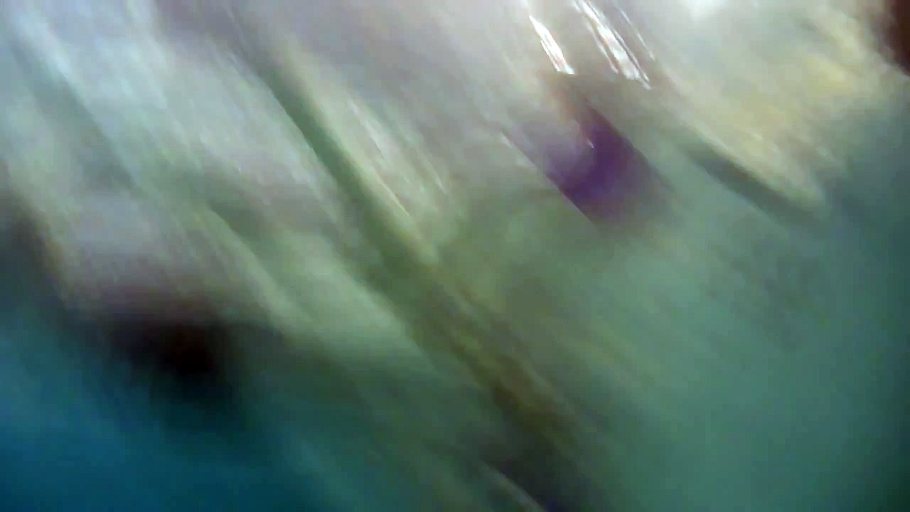 William diving down to get the camera from the bottom of the pool