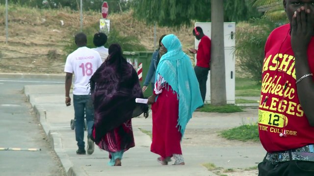Mediterranean shipwreck survivors join migrant crowd in Sicily