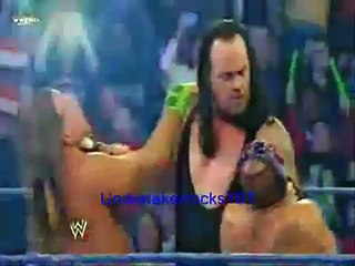 Download Video: Undertaker chokeslams Rey Mysterio and Shawn Michaels