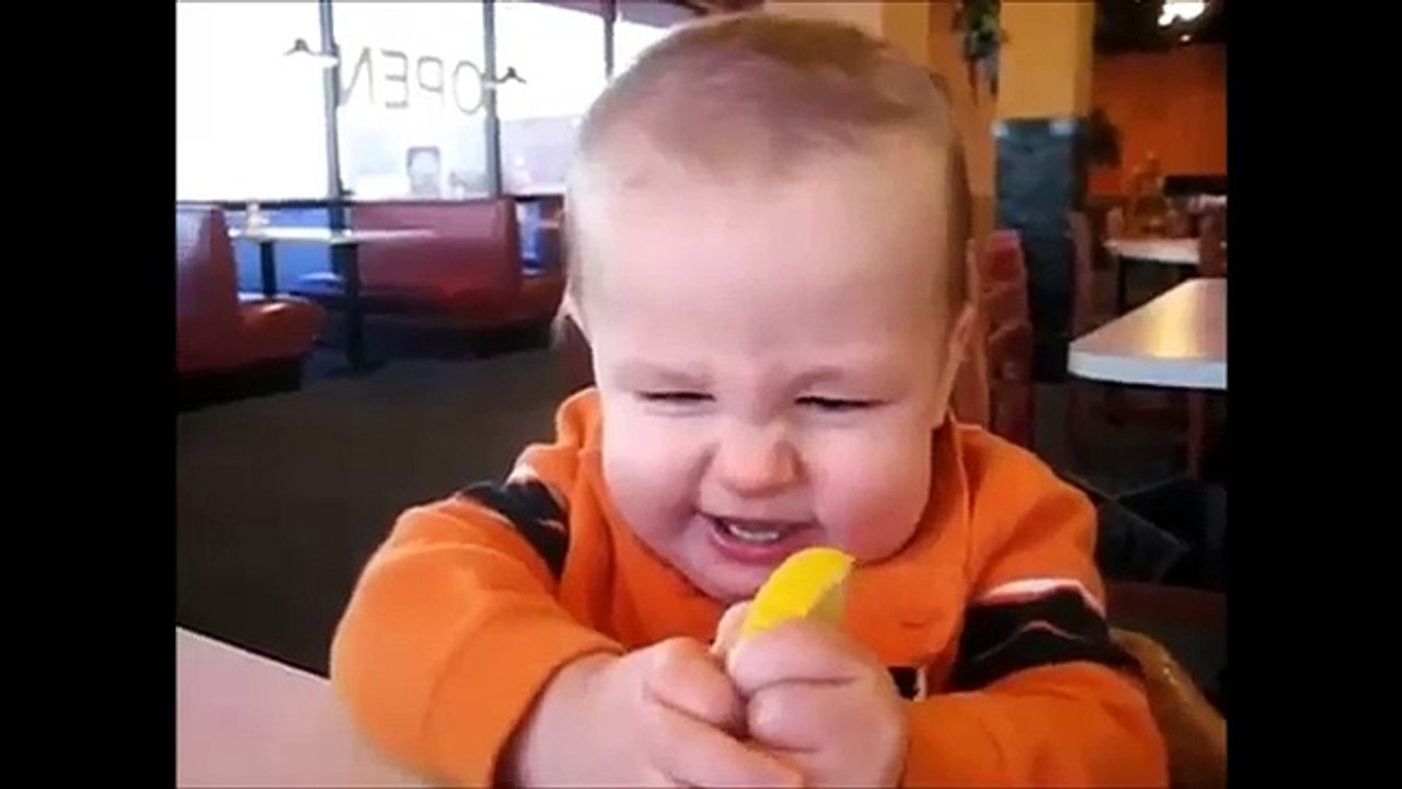Baby eats lemon:-) :-) :-) :-)