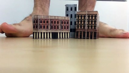 Giant flattens village (slow motion)