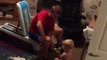 Helpful baby gives dad weightlifting tips!