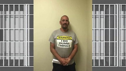 Man arrested wearing shirt reading "Warning: I do dumb things."