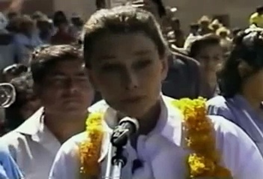 Audrey making a speech to villagers