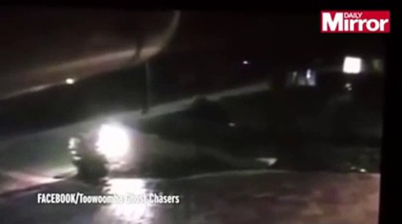 Watch spooky moment 'ghost' takes a midnight stroll in the back yard of 'haunted' house