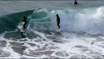 Surfers ride waves in epic slow motion