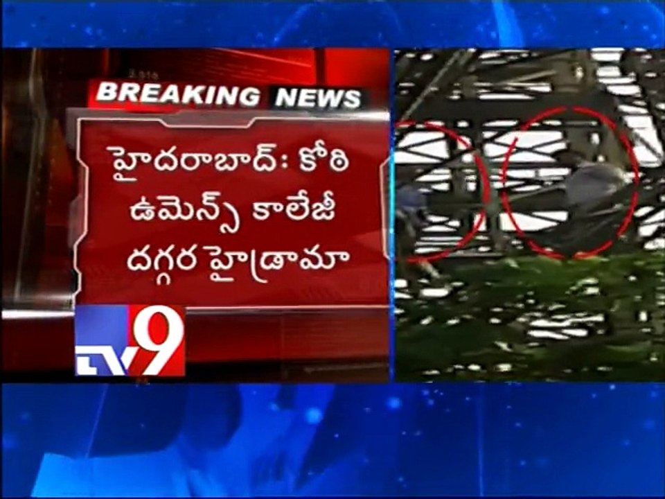 Students climbs hoarding ,demands Govt to back lands