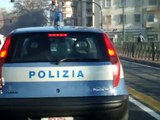 Italian policeman using a mobile phone while driving