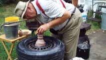 pottery throwing demo on a car tire~by Hillar Bergman