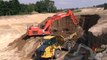 Hitachi Zaxis 470 Excavator Loading The New Komatsu HM300-3 and Volvo Dumpers