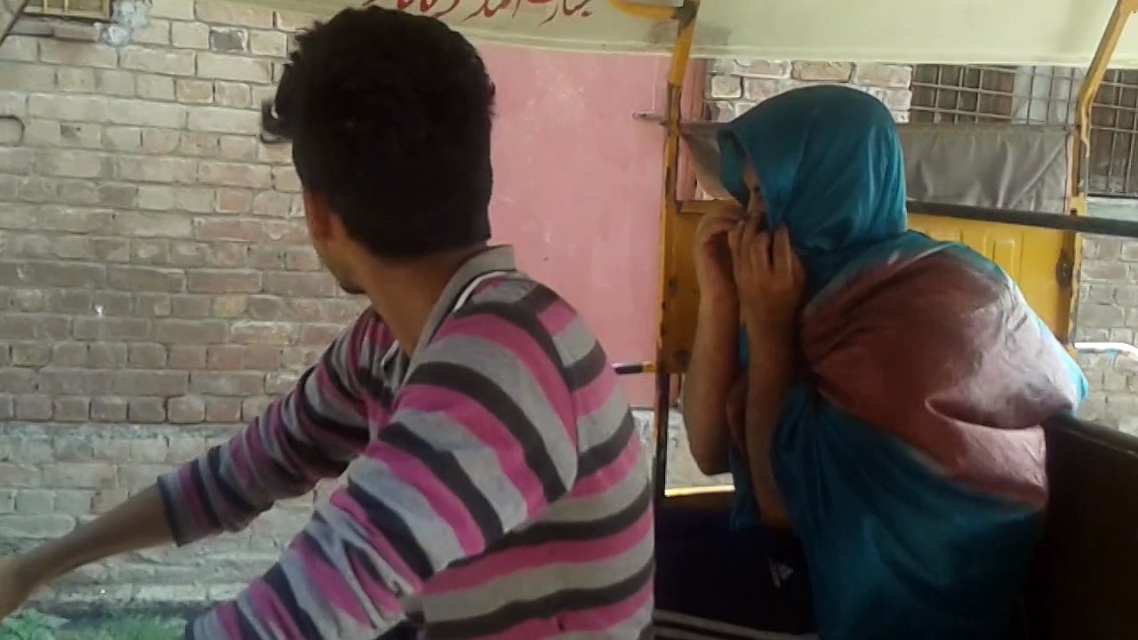 Girls dealing with rikshaw driver