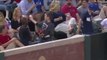 Kid at Baseball game tries to impress lady giving her a ball!!! So cute...