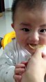 cutest baby i ever seen eating lemon loll...