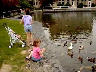 Feeding the ducks and fish. Roaring Spring, Pa