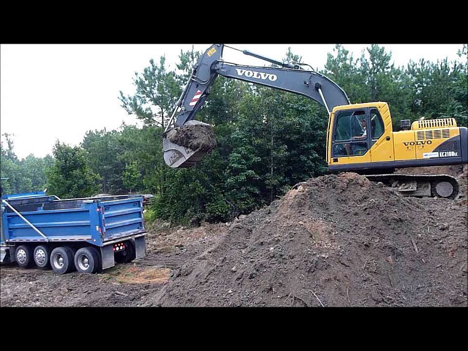 Volvo EC210 Excavator Rocking Out Trucks video Dailymotion