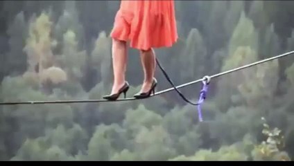 Girl is walking on a rope it is amazing scene..